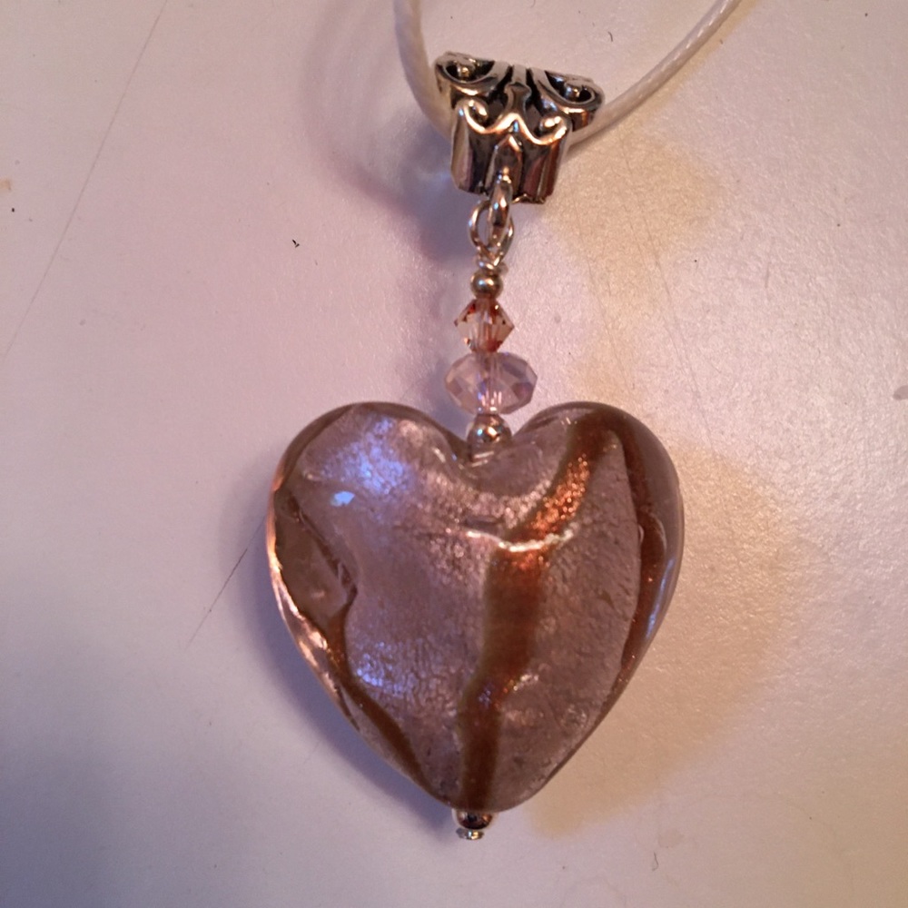 Glass heart pendant on white silk cord